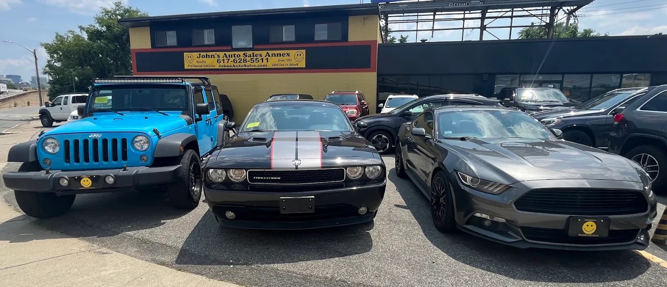 John's Auto Sales Annex and vehicles on the dealership lot
